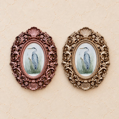 Blue Heron in Reeds, gold and rose gold side by side