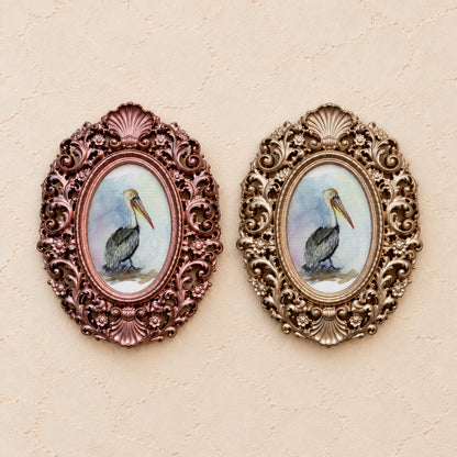 Brown Pelican, gold and rose gold side by side