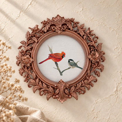 Cardinals on a Winter Branch round framed art print, rose gold baroque frame