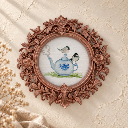 Chickadee on a Teapot round framed art print, rose gold baroque frame