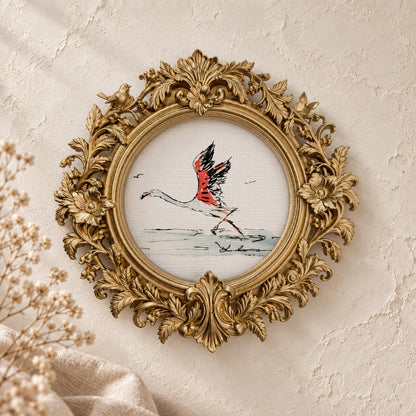 Flamingo Taking Flight round framed art print, gold baroque frame
