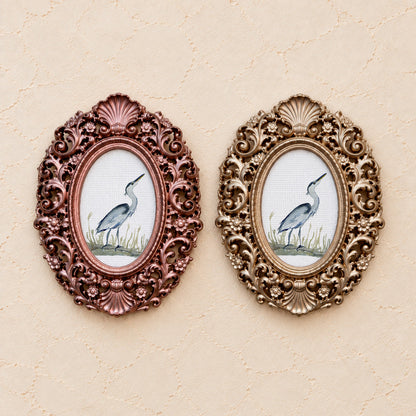 Heron in the Grass, gold and rose gold side by side