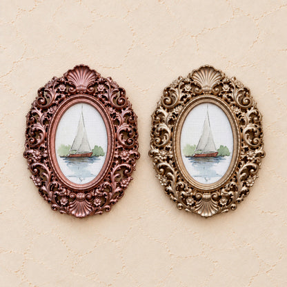Red-Hulled Sailboat, gold and rose gold side by side