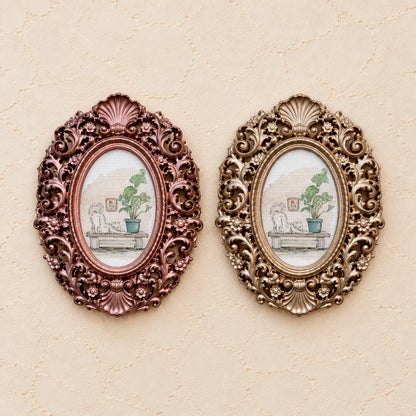 Stretching Cat on a Shelf, gold and rose gold side by side
